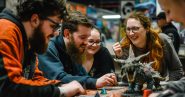 young adults playing a board game