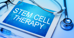 A tablet with the text, "Stem Cell Therapy" printed on it accompanied by a pair of glasses and stethoscope