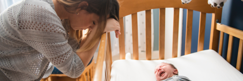 tired mother with sleepless infant